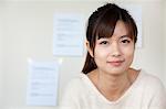 Young businesswoman smiling in the office, portrait