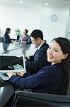 Businesswoman Looking Over Her Shoulder at the Camera