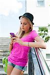 Teenage Girl using Cell Phone Outdoors, Mannheim, Baden-Wurttemberg, Germany