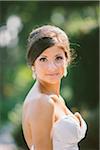 Close-up Portrait of Bride outdoors, looking at camera