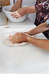 Mother and son baking together