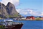 Industrial fishing port in picturesque town of Reine on Lofoten islands in Norway during summer