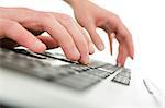 Detail of businessman hands typing on computer keyboard. Over white background.