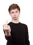 Sullen teenager shows the middle finger. Isolated on a white background