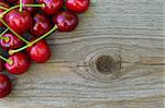 Group of Fresh Ripe Red Sweet Cherries on Wooden Background. Closeup. Space for Text