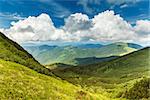 Image of a beautiful carpathian mountains with beautiful cumulus cloudes in the sky. Marmaros massif in eastern Carpathians.