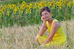 beautiful girl on fiel with background of sunflower