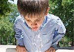 Child drinking water from a fountain. Close up