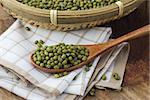 Mung beans over wooden spoon