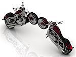Two motorcycles standing wheel to wheel on a white background