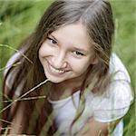 portrait of beautiful teen girl on the grass, upper point