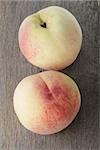 fresh whole peaches, on old wooden table