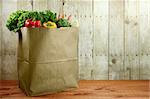 Bagged Grocery Produce Items on a Wooden Plank