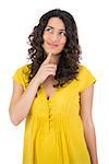 Pensive casual young woman posing on white background