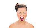 Glamorous woman with red lips screaming on white background