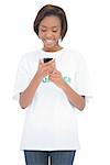 Cheerful volunteer woman looking at her mobile phone on white background
