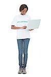 Cheerful volunteer woman using laptop on white background