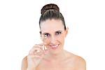 Happy gorgeous woman using eyelash curler on white background