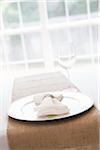 Simple and elegant place setting for one with place charger and napkin