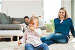 Family Relaxing in Living Room, Mannheim, Baden-Wurttemberg, Germany