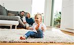 Family Relaxing in Living Room, Mannheim, Baden-Wurttemberg, Germany