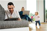 Family Relaxing in Living Room at Home, Mannheim, Baden-Wurttemberg, Germany