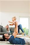 Family in Living Room at Home, Mannheim, Baden-Wurttemberg, Germany