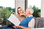 Young Woman and Senior Man looking at Document, Mannheim, Baden-Wurttemberg, Germany