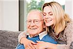 Portrait of Young Woman Hugging Senior Man, Mannheim, Baden-Wurttemberg, Germany