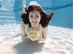 USA, Utah, Orem, Portrait of young bride with bouquet under water