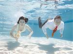 USA, Utah, Orem, Wedding couple under water