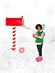 Girl (4-5) sending letter to Santa