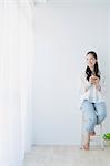 Young woman sitting with cup of tea in the living room