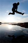 Silhouette of man jumping