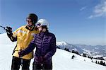 Young couple standing in a ski resort, Sudelfeld, Bavaria, Germany