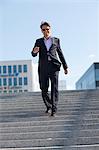 Businessman Walking  Down Stairs, Munich, Bavaria, Germany