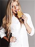 Blonde woman eating rabbit cookie