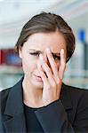 Stressed businesswoman looking at camera