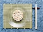 Overhead View of Rice Cake on Plate with Chop Sticks, Studio Shot