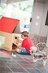 Boy building kennel for his dog