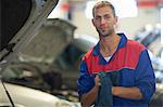 Car mechanic on completion of job