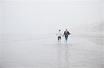 Couple running on beach