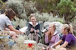 Young group of hikers taking a break