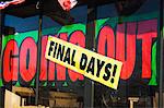 Closing down signs on store window