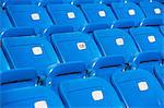 Empty blue seating in sports stadium