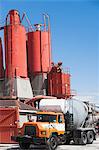 Truck parked by cement factory