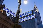 Pershing Square and Park Avenue street signs at dusk, New York City, USA
