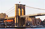 Detail of Brooklyn bridge at sunset  New York City, USA