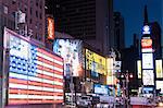 Illuminated billboards at night, New York, USA