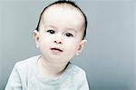 Portrait of baby boy wearing grey top